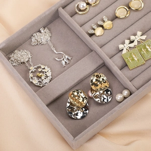 Gray velvet jewelry tray organizer for earrings and necklaces with divided compartments