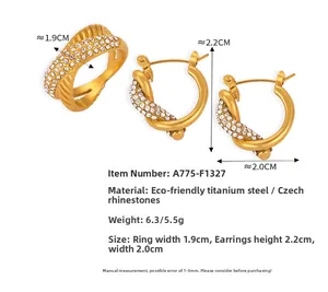 Macro detail of gold-plated titanium steel ring and earrings set with crystal pavé