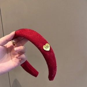 Retro red knit headband with golden heart buckle and soft fabric texture for women