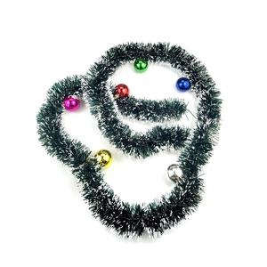 Green and white Christmas tinsel garland with colorful ornaments for tree decoration