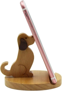 Detail of wooden dog phone stand with smooth wood grain finish holding a pink smartphone