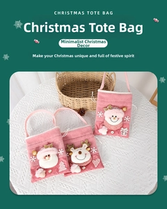 Detailed view of pink Christmas felt bags with 3D Santa, Reindeer, and Snowman dolls