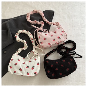 Chic corduroy drawstring strawberry print underarm bag in pink, white, and black colors