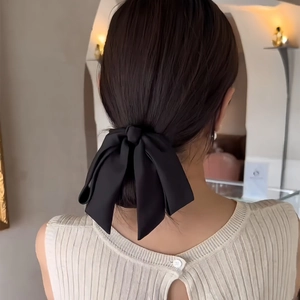Elegant large black satin bow spring hair clip for low bun and ponytail hairstyles