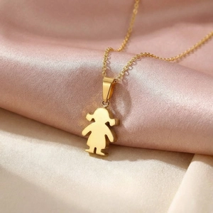Detailed view of a gold-plated girl silhouette pendant on a delicate link chain