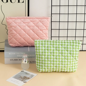 Quilted corduroy and plaid cosmetic bags with secure zippers for vanity storage