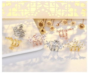 Detailed view of floral cubic zirconia earrings in gold, silver and rose gold finishes