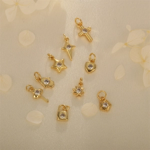Gold 18K plated charms set with star, heart and cross shapes featuring inlaid cubic zirconia