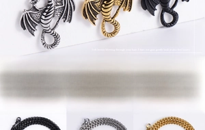 Detailed view of punk dragon pendants with textured scales in silver, gold, and black steel