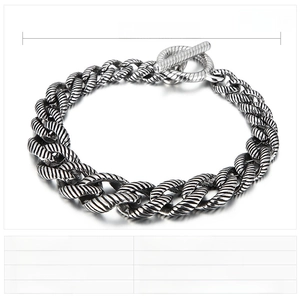 Detail of vintage stainless steel Cuban link bracelet with OT toggle clasp and 16mm width