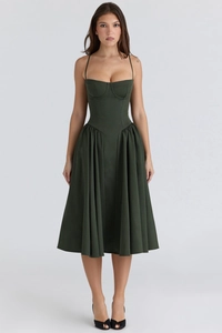 Detail of a dark green backless maxi dress featuring a corset-style bust and pleated hem