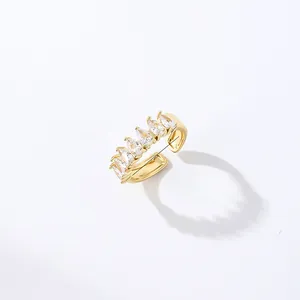 Close-up of gold-plated open ring featuring seven pear-cut cubic zirconia gemstones