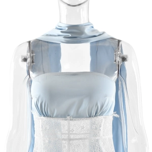 Detail of light blue satin bodice with white floral lace trim and matching neck scarf