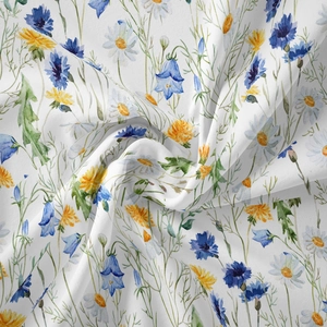 Detail of floral tapestry fabric with watercolor wildflowers and soft elegant draping
