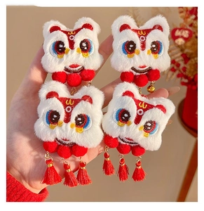 Detail of 4-piece Chinese lion dance hair clips with plush fur and festive tassels