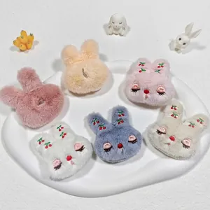 Cute plush rabbit head accessory with cherry embroidery and functional back opening