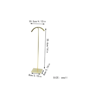 Golden metal bag display stand with dimensions 14-inch height and square base