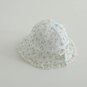 Detail of floral lace baby sun hat featuring sweet ruffle brim and bow decoration