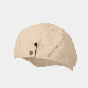 Retro distressed beige newsboy cap with vintage hole details and side metal button