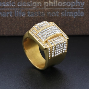 Close-up of gold-plated pentagram ring showing micro-pave zircons and brushed texture