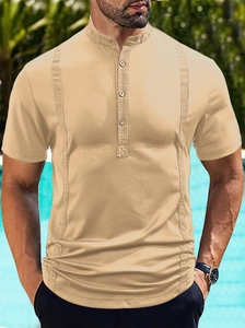 Detail of short sleeve beige polo shirt with vertical texture and mandarin collar