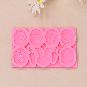 Pink silicone Easter mold with egg, rabbit, and carrot shapes for chocolate and fondant