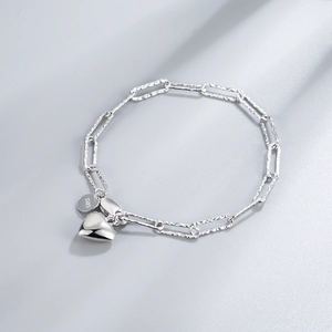 925 sterling silver chain bracelet featuring a heart pendant and S925 engraved tag