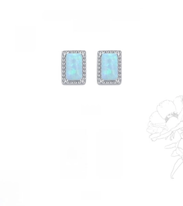 Detail of silver and gold rectangular opal earrings with micro-bead edges in a set