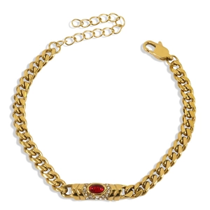 Golden Cuban link bracelet featuring an oval red gemstone with crystal accents