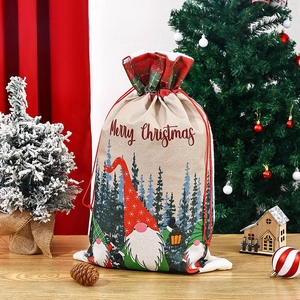 Christmas gnome drawstring gift bag in faux linen on festive wooden tabletop decoration