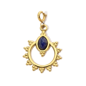 Detail of bohemian gold sunburst pendant with oval blue gemstone inlay on white background
