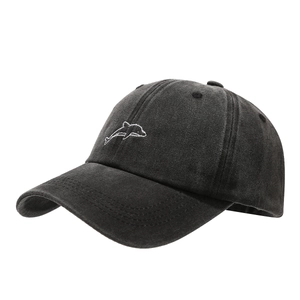 Vintage washed cotton baseball cap featuring minimalist white dolphin embroidery in dark grey