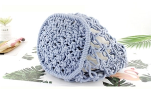 Detail of blue handcrafted woven cotton rope bag with unique mesh net structure design