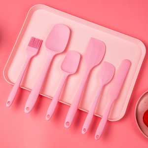 Pink 6-piece silicone kitchen utensil set with spatulas and oil brush in a matching tray