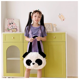 Detail of a large panda plush handbag with soft faux fur and black handles for girls