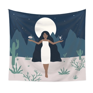 Detail of bohemian tapestry featuring a moonlit desert scene and celestial goddess