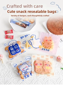 Close-up of cute cartoon snack bags with matte transparent finish on a lace tablecloth