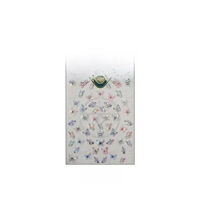 Macro detail of 3D embossed butterfly nail stickers with rhinestones and floral accents