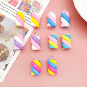 Detailed view of ten colorful spiral resin marshmallow charms for DIY jewelry making