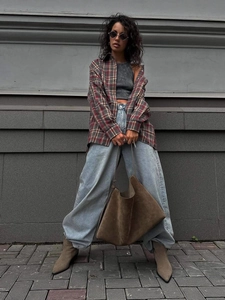 Vintage red and green plaid long sleeve shirt styled with a chic urban outfit