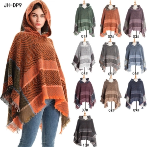 Women's autumn winter hooded poncho with herringbone pattern and tassel trim details