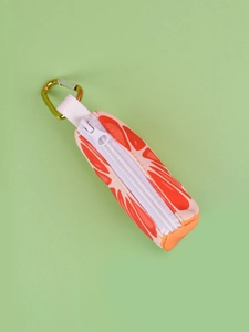 Close-up of grapefruit print pet waste bag dispenser with metal carabiner clip