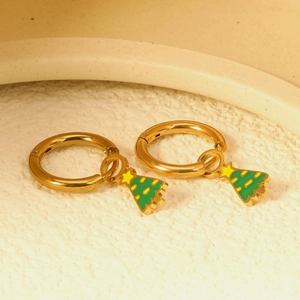 Golden hoop earrings with green Christmas tree charms featuring yellow star details