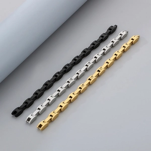 Men's stainless steel watch-link bracelets in black, gold, and silver finishes