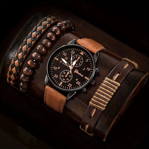 Detailansicht der Luxus-Quarzuhr mit braunem Lederarmband und Vintage-Armbändern