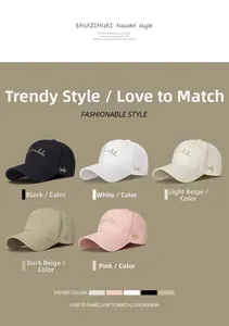 Detail of five cotton baseball caps with side 'lucky' embroidery in assorted colors