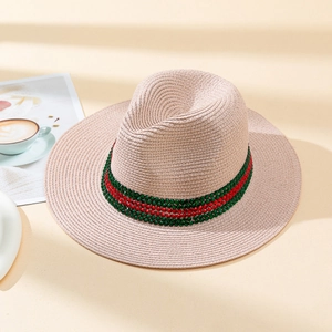 Chic woven straw sun hat featuring vibrant red and green rhinestone band for summer style