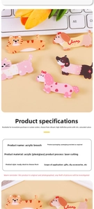 Detail of laser-cut acrylic cartoon dog and cat pins on a decorative desk background