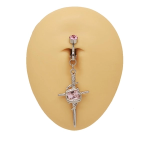Detail of silver heart belly ring with pink rhinestones on a skin model prop