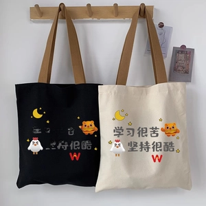 Minimalist canvas tote bags with cartoon prints in black and off-white for students